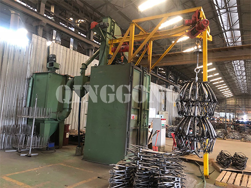 Hanger type shot blasting machine for motorcycle bumper